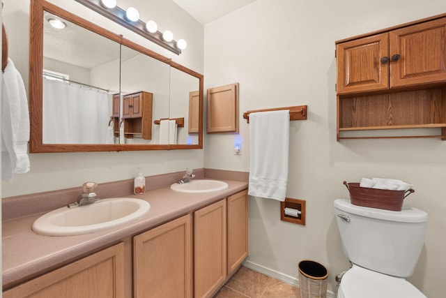 455 Colonial Ave SW, Los Lunas, NM 87031 - full bathroom featuring double vanity, tile patterned flooring, and a shower with curtain