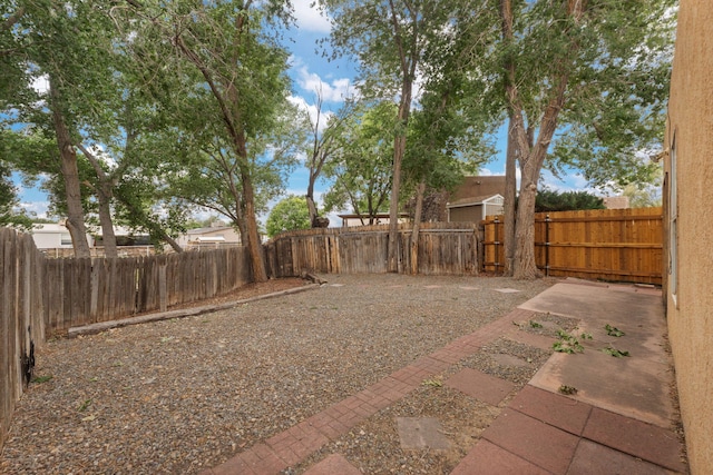 455 Colonial Ave SW, Los Lunas, NM 87031 - fenced backyard featuring a patio