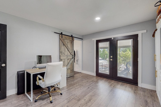 4320 Blumenshine Cir SW, Albuquerque, NM 87105 - office space featuring french doors, a barn door, and wood finished floors