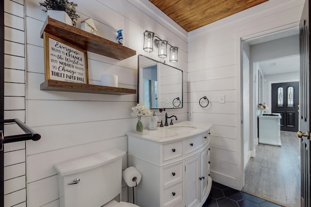 4320 Blumenshine Cir SW, Albuquerque, NM 87105 - half bath with wood ceiling, vanity, tile patterned floors, and wooden walls