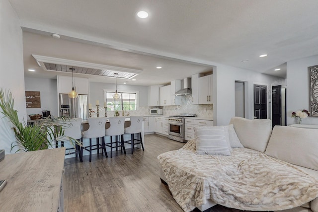 4320 Blumenshine Cir SW, Albuquerque, NM 87105 - living area featuring light wood finished floors and recessed lighting