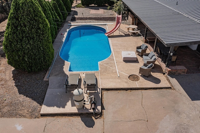 4320 Blumenshine Cir SW, Albuquerque, NM 87105 - outdoor pool featuring a water slide and a patio area