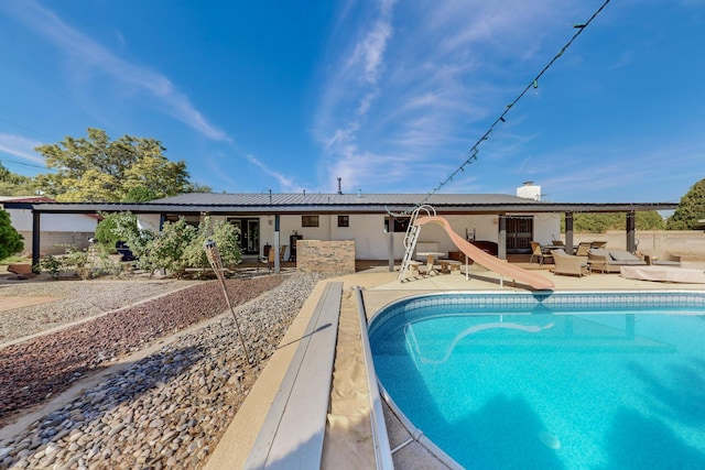 4320 Blumenshine Cir SW, Albuquerque, NM 87105 - view of swimming pool with a water slide and a patio