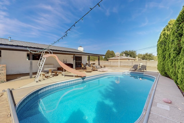 4320 Blumenshine Cir SW, Albuquerque, NM 87105 - view of pool featuring a patio, a water slide, a fenced backyard, and outdoor lounge area