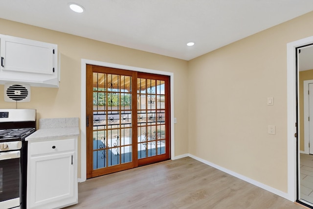 10409 Britt Ct NE, Albuquerque, NM 87112 - doorway with light wood finished floors and recessed lighting