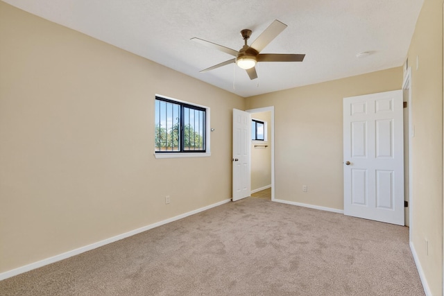 10409 Britt Ct NE, Albuquerque, NM 87112 - unfurnished bedroom featuring carpet flooring and a ceiling fan