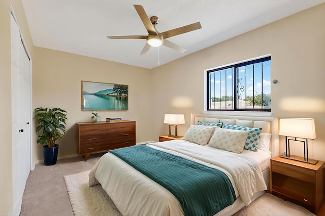 10409 Britt Ct NE, Albuquerque, NM 87112 - bedroom with light colored carpet, a ceiling fan, and a closet