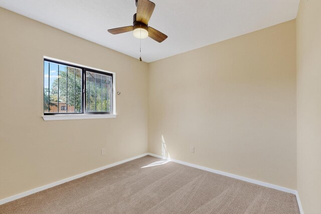 10409 Britt Ct NE, Albuquerque, NM 87112 - spare room with carpet flooring and ceiling fan