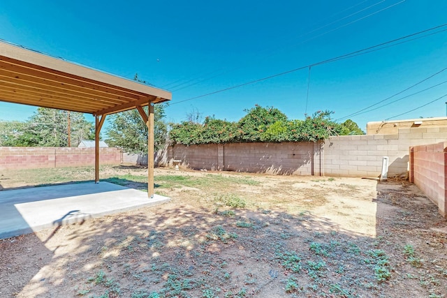 10409 Britt Ct NE, Albuquerque, NM 87112 - fenced backyard featuring a patio area