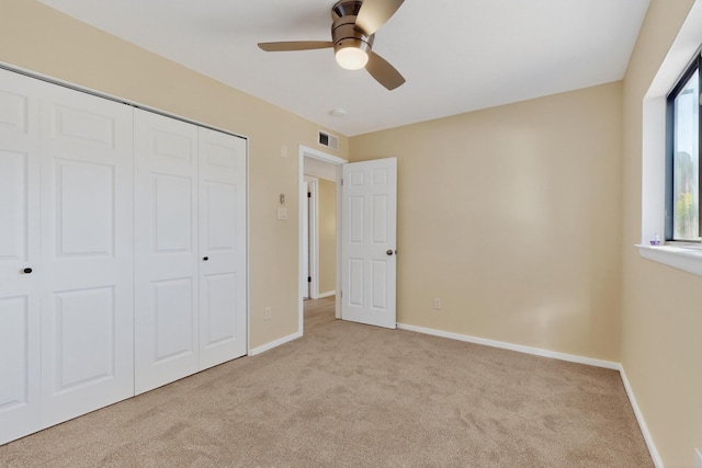 10409 Britt Ct NE, Albuquerque, NM 87112 - unfurnished bedroom featuring carpet, a closet, and a ceiling fan