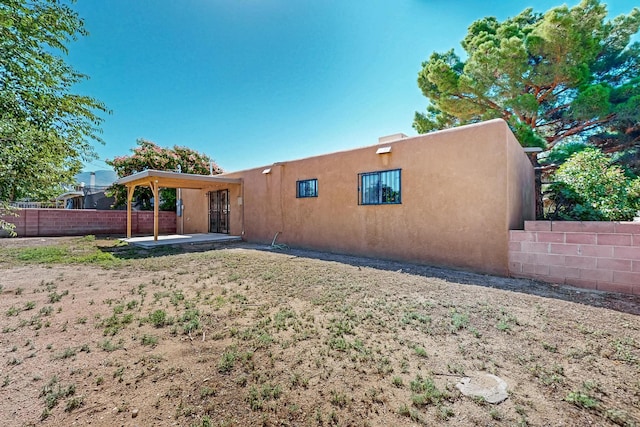 10409 Britt Ct NE, Albuquerque, NM 87112 - rear view of house with a patio and stucco siding