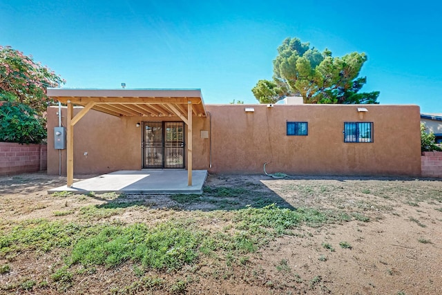 10409 Britt Ct NE, Albuquerque, NM 87112 - rear view of property with a patio and stucco siding