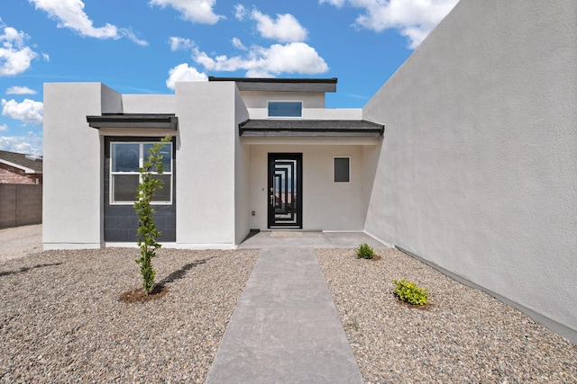 1109 11th St SE, Rio Rancho, NM 87124 - property entrance with stucco siding