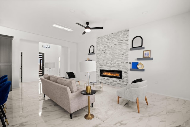1109 11th St SE, Rio Rancho, NM 87124 - living area with marble look tile flooring, a fireplace, a ceiling fan, and a chandelier