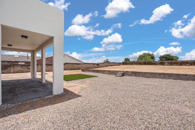 1109 11th St SE, Rio Rancho, NM 87124 - fenced backyard with a patio area