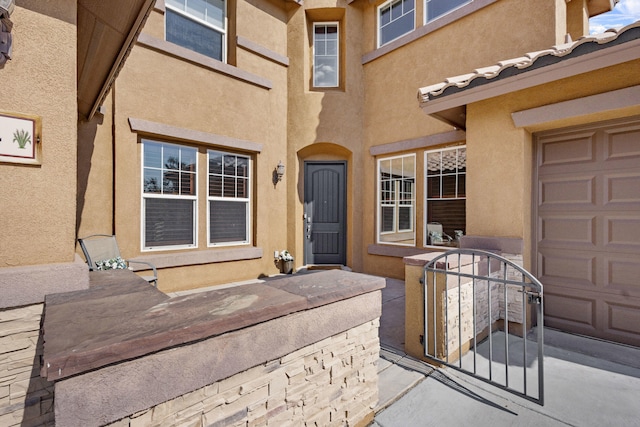 44 Los Balcones Pl NE, Rio Rancho, NM 87124 - property entrance with stucco siding and a garage