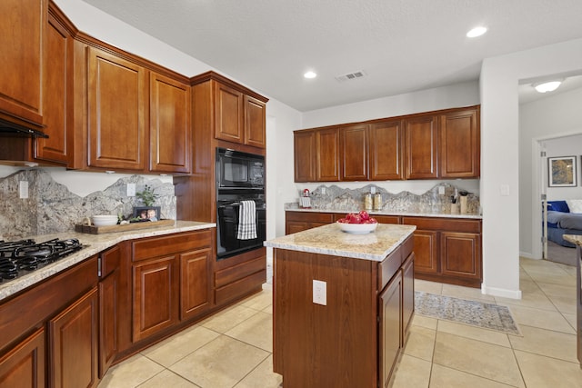 44 Los Balcones Pl NE, Rio Rancho, NM 87124 - kitchen with black appliances, backsplash, light tile patterned flooring, light stone counters, and recessed lighting