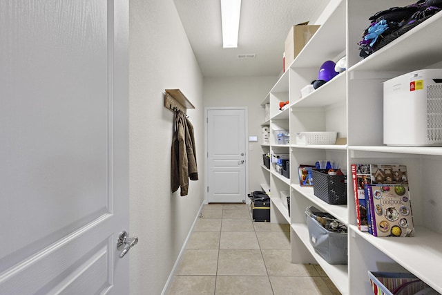 44 Los Balcones Pl NE, Rio Rancho, NM 87124 - washroom featuring light tile patterned floors and baseboards