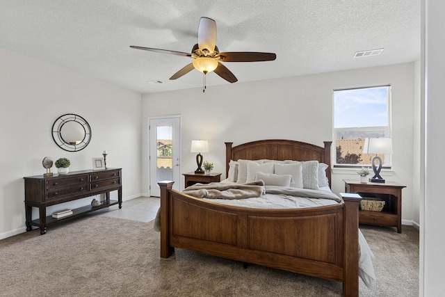 44 Los Balcones Pl NE, Rio Rancho, NM 87124 - bedroom with carpet floors, ceiling fan, a textured ceiling, and access to exterior
