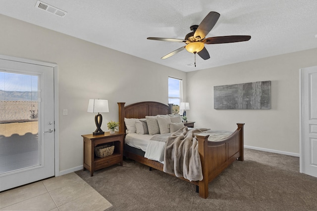 44 Los Balcones Pl NE, Rio Rancho, NM 87124 - bedroom featuring carpet flooring, a ceiling fan, a textured ceiling, and access to exterior