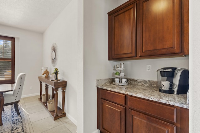 44 Los Balcones Pl NE, Rio Rancho, NM 87124 - bar with light tile patterned floors and baseboards