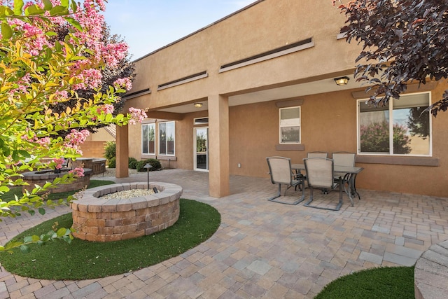 44 Los Balcones Pl NE, Rio Rancho, NM 87124 - view of patio with an outdoor fire pit and outdoor dining area