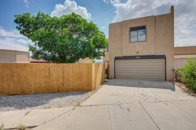 4920 Black Dr NW, Albuquerque, NM 87120 - view of front of house with a garage, concrete driveway, and stucco siding