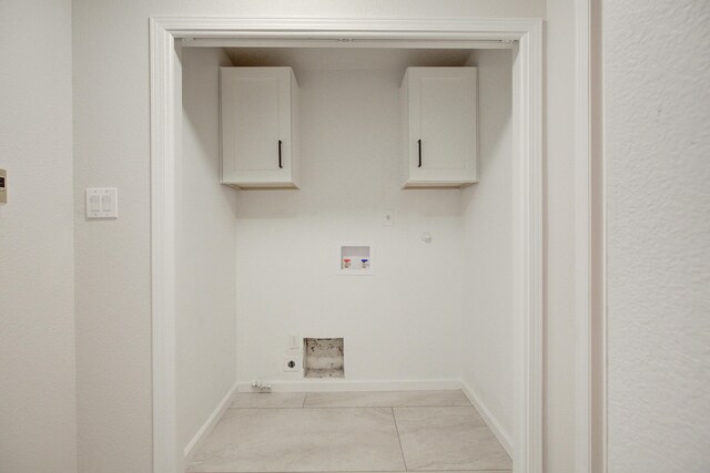 4920 Black Dr NW, Albuquerque, NM 87120 - laundry room with hookup for a gas dryer, cabinet space, hookup for an electric dryer, light marble finish flooring, and washer hookup
