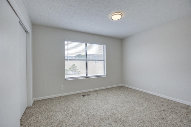 4920 Black Dr NW, Albuquerque, NM 87120 - unfurnished bedroom with carpet flooring, a closet, and a textured ceiling