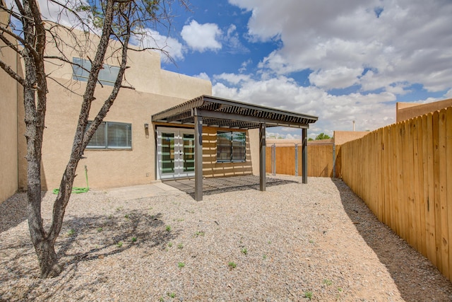 4920 Black Dr NW, Albuquerque, NM 87120 - rear view of house with french doors, stucco siding, a fenced backyard, and a patio area