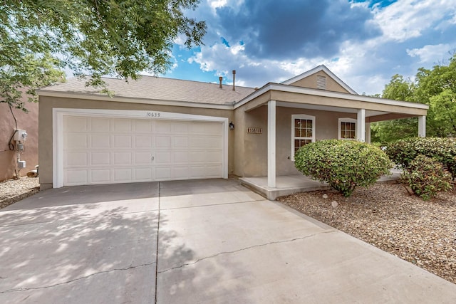 10639 Miera Dr NW, Albuquerque, NM 87114 - ranch-style house with stucco siding, driveway, an attached garage, and a porch