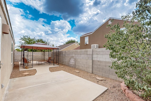 10639 Miera Dr NW, Albuquerque, NM 87114 - fenced backyard with a gazebo and a patio area