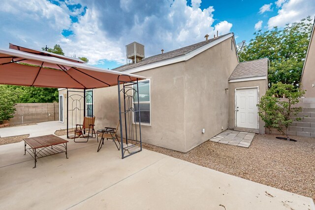 10639 Miera Dr NW, Albuquerque, NM 87114 - rear view of property featuring a patio, stucco siding, and a gazebo