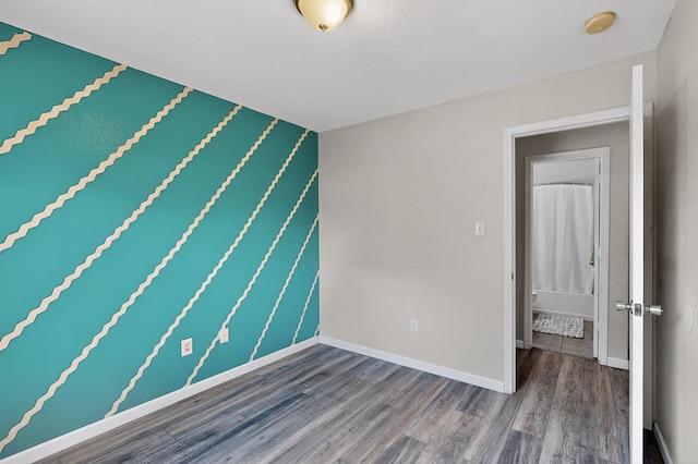 10639 Miera Dr NW, Albuquerque, NM 87114 - unfurnished room with wood finished floors and a smoke detector