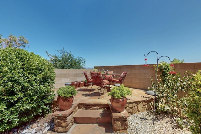 8712 Sandwater Rd NW, Albuquerque, NM 87120 - fenced backyard with a patio