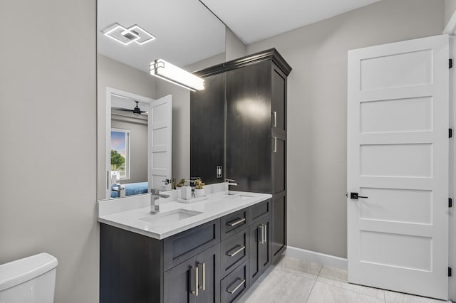 7900 Aguila St NW, Albuquerque, NM 87120 - bathroom featuring double vanity and a ceiling fan