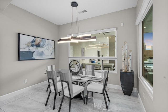 7900 Aguila St NW, Albuquerque, NM 87120 - dining room featuring baseboards