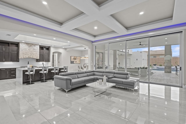7900 Aguila St NW, Albuquerque, NM 87120 - living room featuring arched walkways, light marble finish flooring, ceiling fan, and recessed lighting