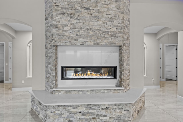 7900 Aguila St NW, Albuquerque, NM 87120 - detailed view of a glass covered fireplace and baseboards