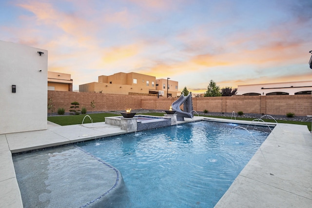 7900 Aguila St NW, Albuquerque, NM 87120 - view of pool featuring a water slide, a fenced backyard, and a patio