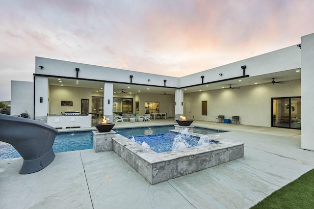 7900 Aguila St NW, Albuquerque, NM 87120 - swimming pool featuring ceiling fan, an in-ground hot tub, an outdoor kitchen, a patio area, and an outdoor living space with a fire pit