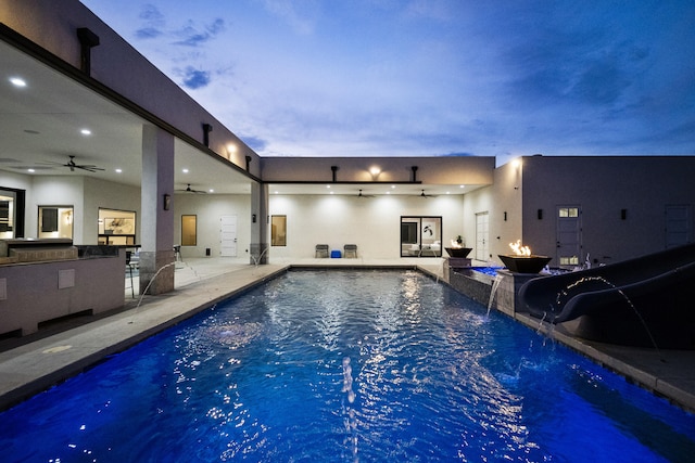 7900 Aguila St NW, Albuquerque, NM 87120 - view of swimming pool with a ceiling fan, a water slide, a patio, and a swimming pool