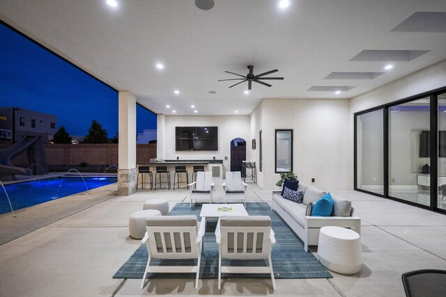 7900 Aguila St NW, Albuquerque, NM 87120 - pool at twilight featuring a water slide, a fenced backyard, a patio, and a fire pit