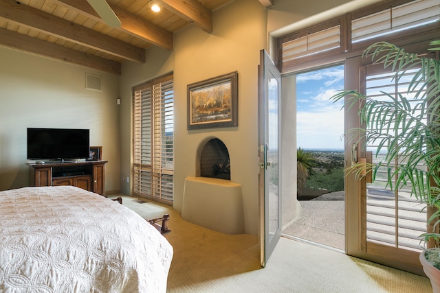 213 Spring Creek Pl NE, Albuquerque, NM 87122 - bedroom with a wooden ceiling with exposed beams, carpet flooring, and access to outside