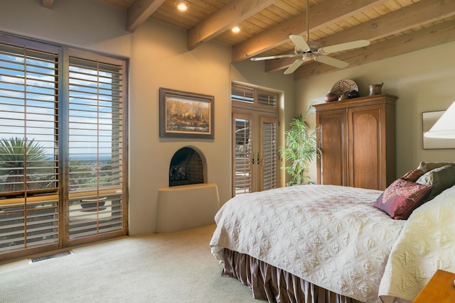 213 Spring Creek Pl NE, Albuquerque, NM 87122 - bedroom featuring a wood ceiling with exposed beams, access to exterior, carpet floors, multiple windows, and french doors