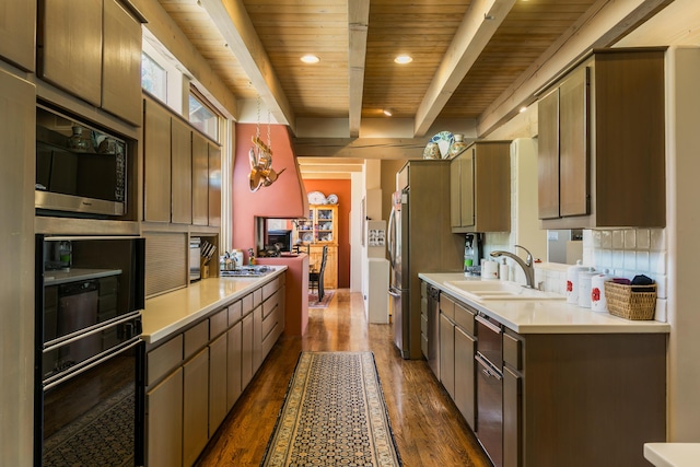 213 Spring Creek Pl NE, Albuquerque, NM 87122 - kitchen featuring stainless steel appliances, a wood ceiling with exposed beams, dark wood finished floors, light countertops, and recessed lighting