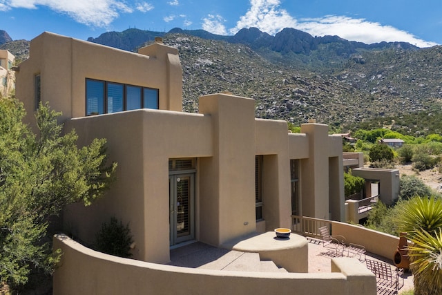 213 Spring Creek Pl NE, Albuquerque, NM 87122 - back of property featuring stucco siding and a mountain view