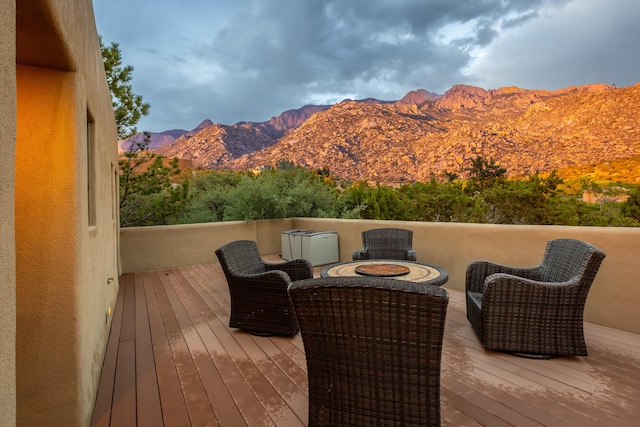 213 Spring Creek Pl NE, Albuquerque, NM 87122 - wooden deck with a mountain view and outdoor lounge area
