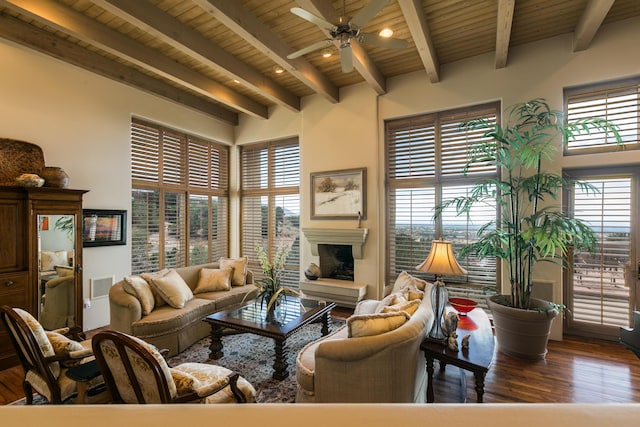 213 Spring Creek Pl NE, Albuquerque, NM 87122 - living room with wood finished floors, ceiling fan, a fireplace with raised hearth, and a wooden ceiling with exposed beams
