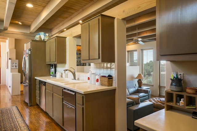 213 Spring Creek Pl NE, Albuquerque, NM 87122 - kitchen featuring stainless steel appliances, wood finished floors, a wood ceiling with exposed beams, ceiling fan, and light countertops